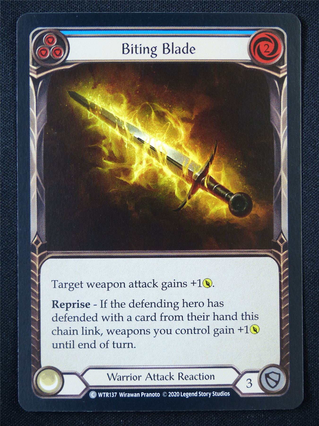 Biting Blade Blue WTR137 Foil - Flesh and Blood Card #395