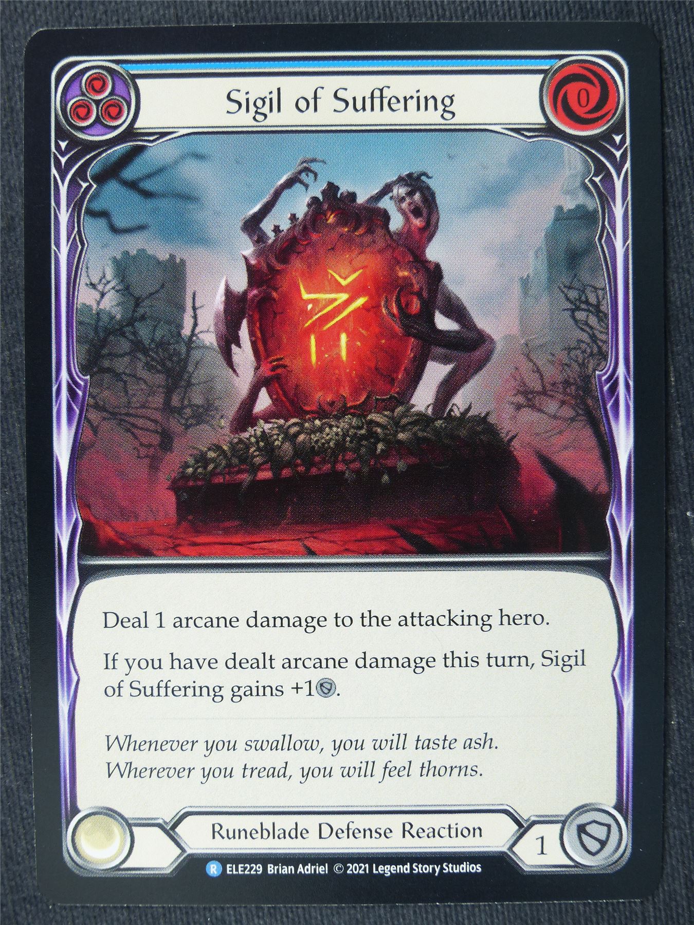 Sigil of Suffering R Blue - 1st Ed Tales of Aria - Flesh and Blood