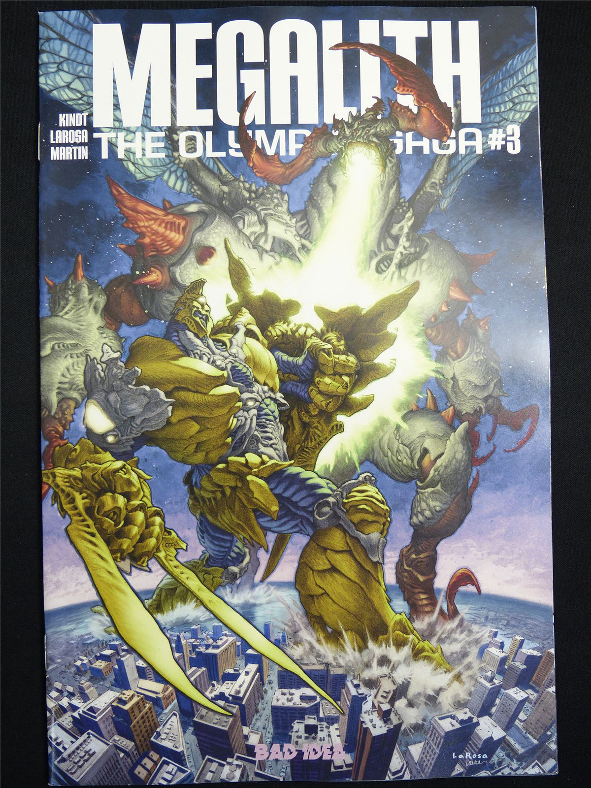 MEGALITH: The Olympic Saga #3 Cvr A - Aug 2026 Bad Idea Comic #3HG