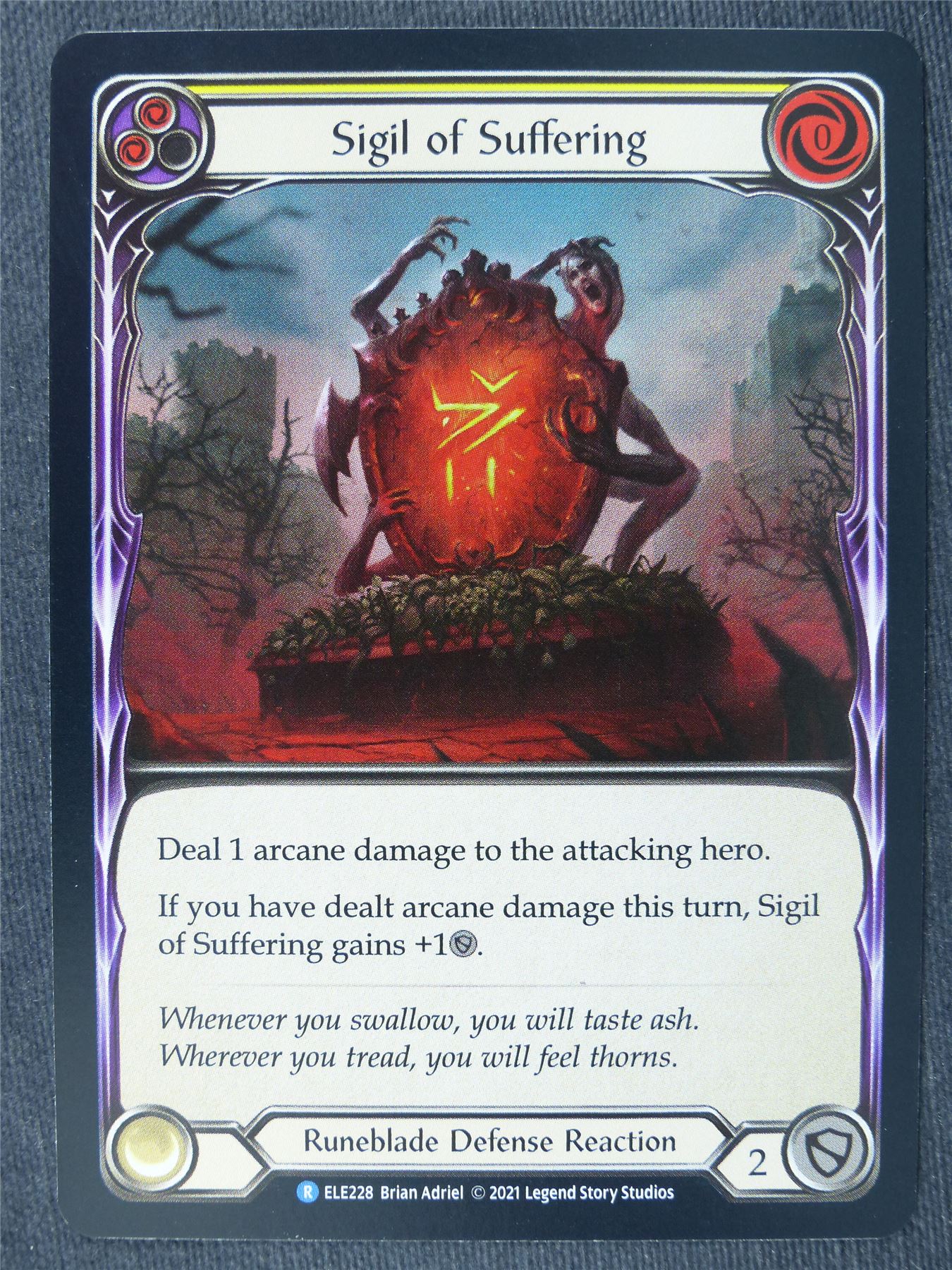 Sigil of Suffering R Foil Yellow - 1st Ed Tales of Aria - Flesh and Blood
