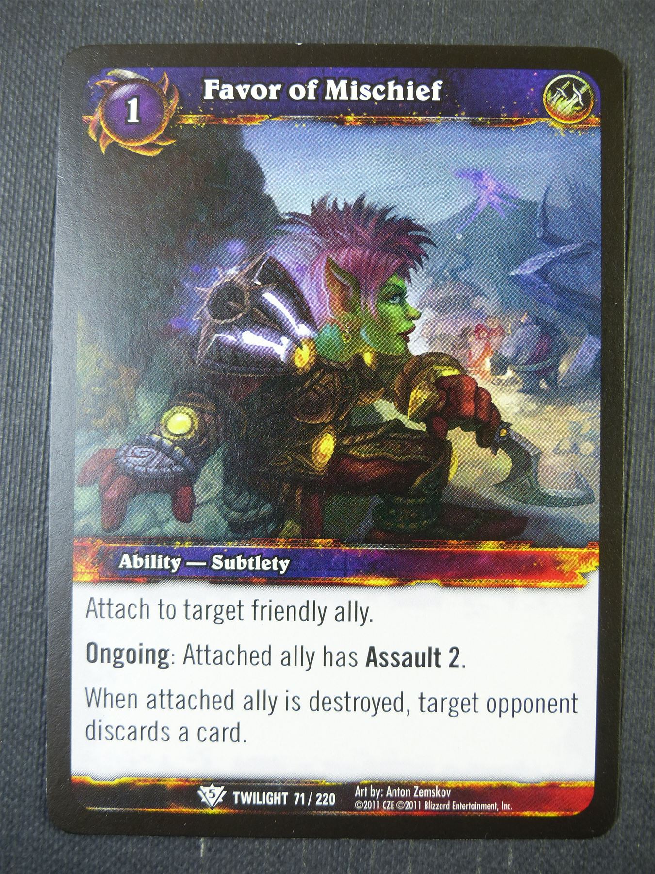 Favor of Mischief 71/220 - WoW Card #14Y